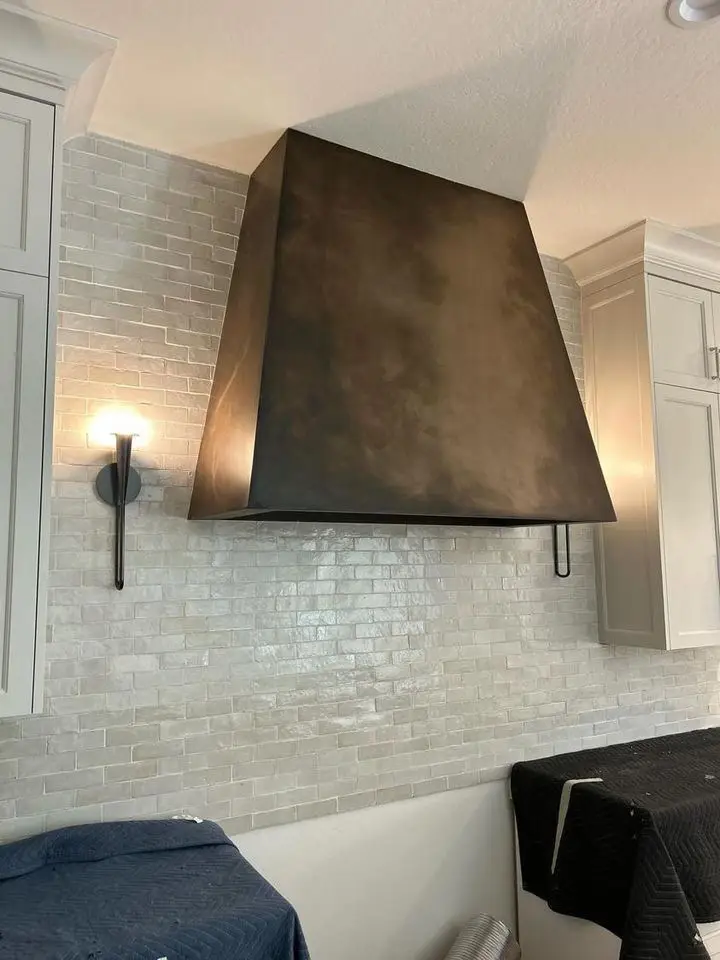 Bronze hood with patina